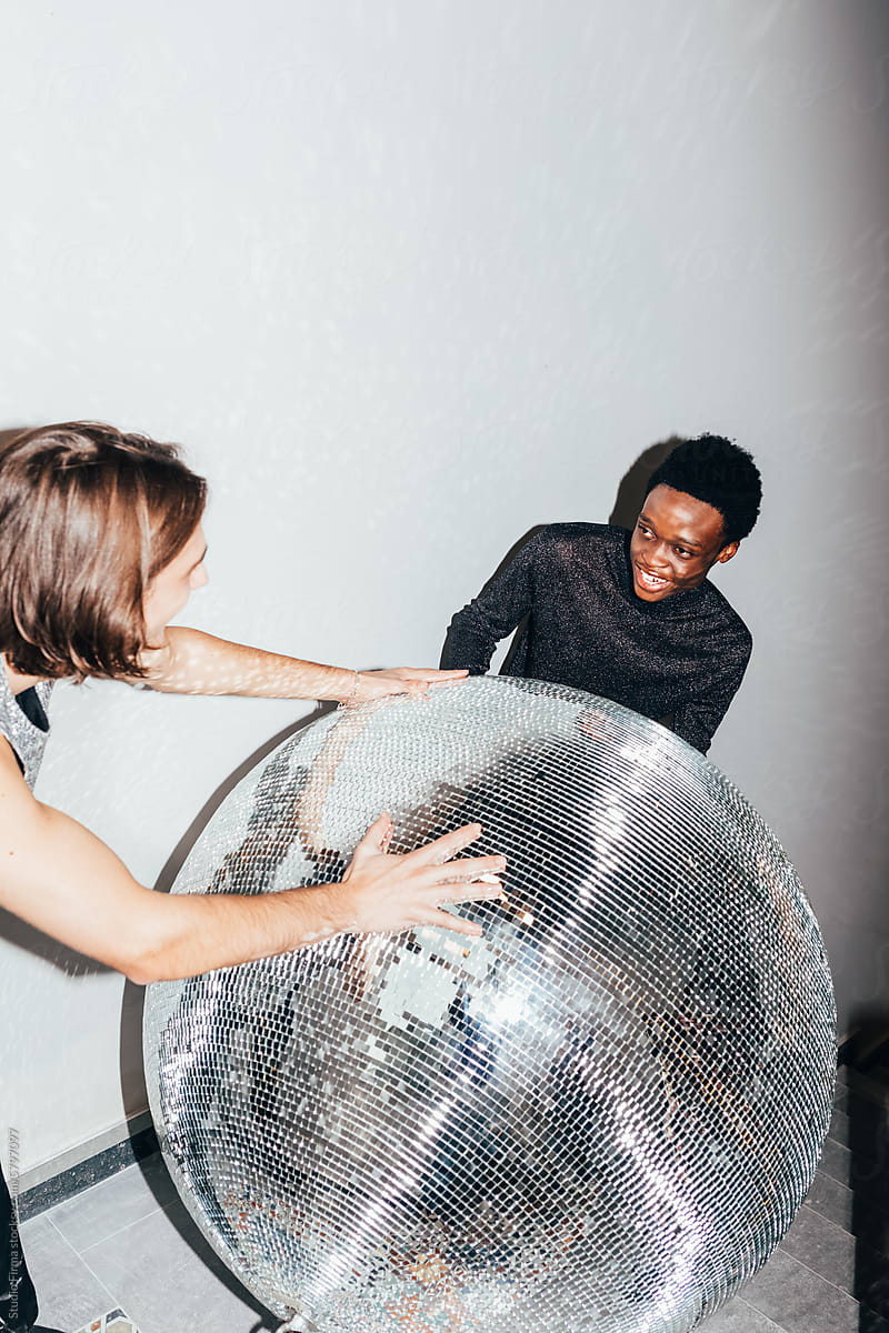 Men with large disco ball
