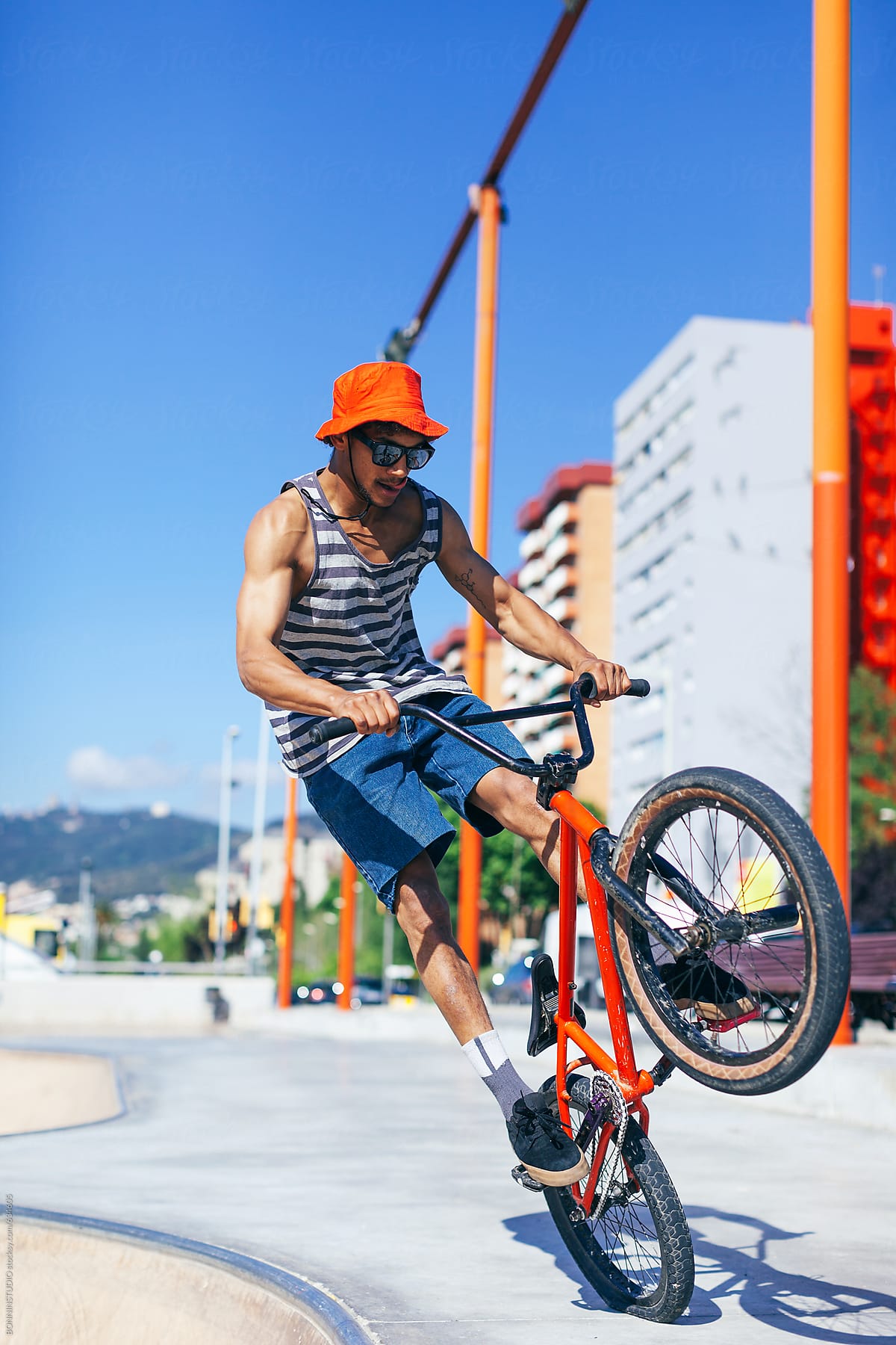Young man jumping with BMX bike.