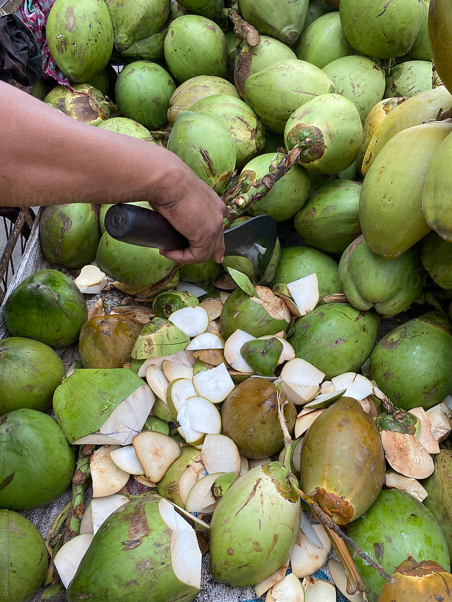 Green coconut piled and selling in roadside