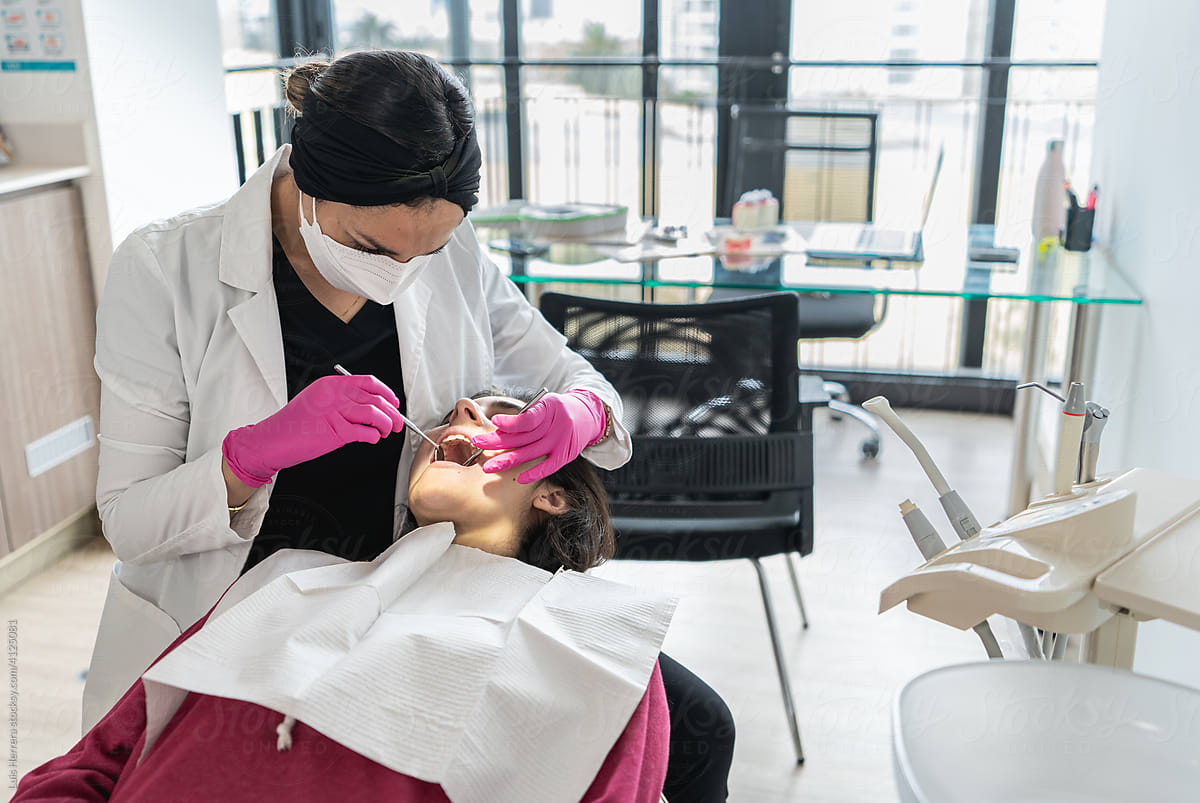 woman dentist treating a patient