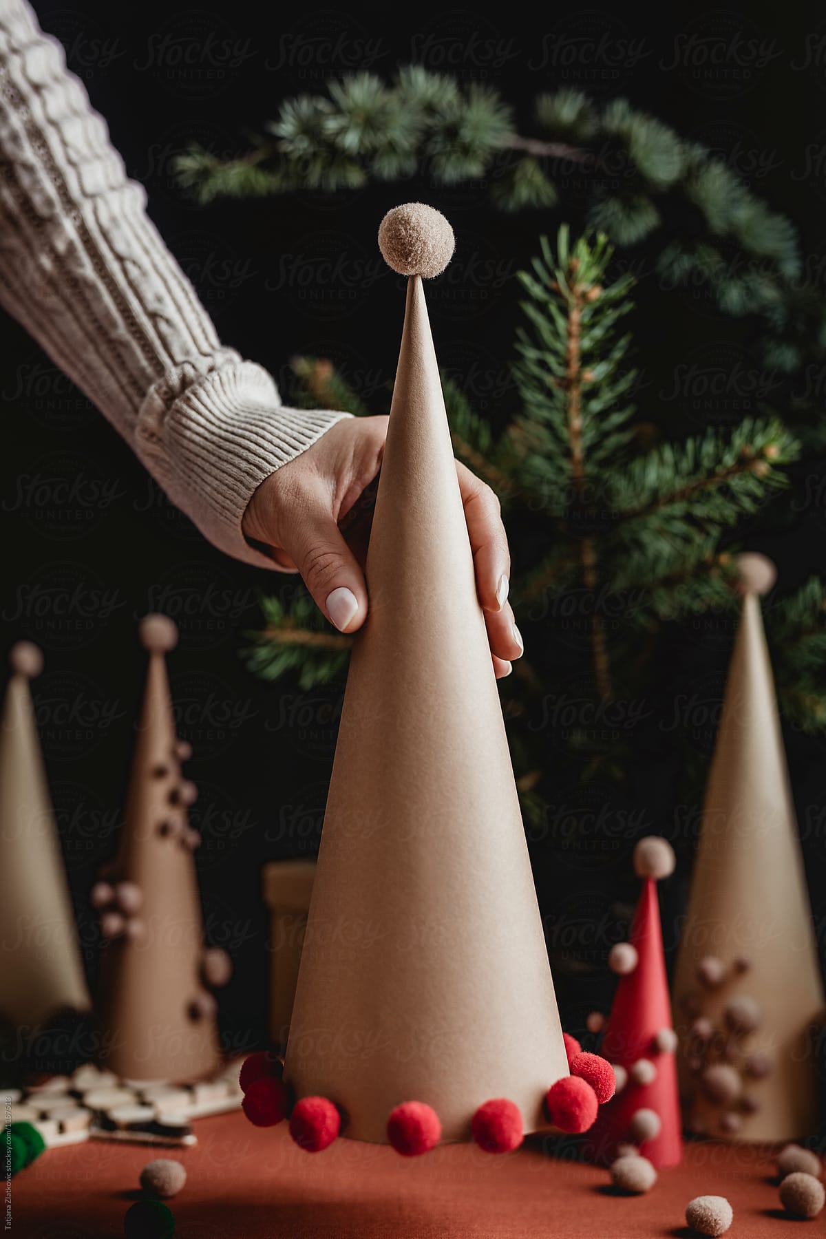 Hand is holding Christmas cone
