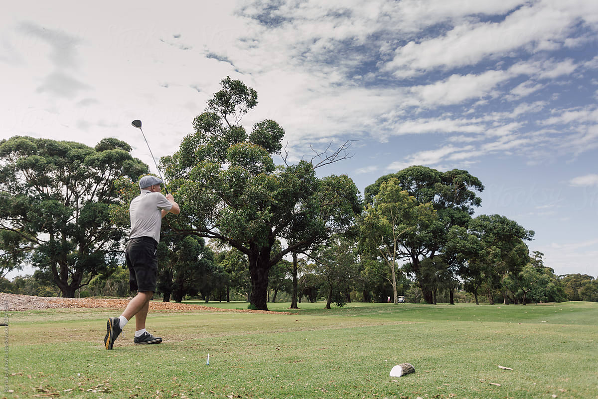 Senior man playing golf on the public golf course