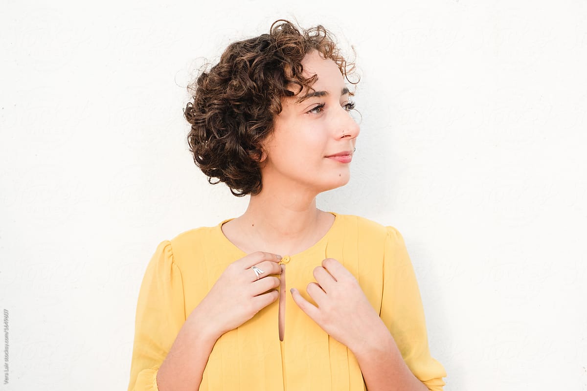 Portrait Of A Confident Woman With Curly Hair By Stocksy Contributor Vera Lair Stocksy