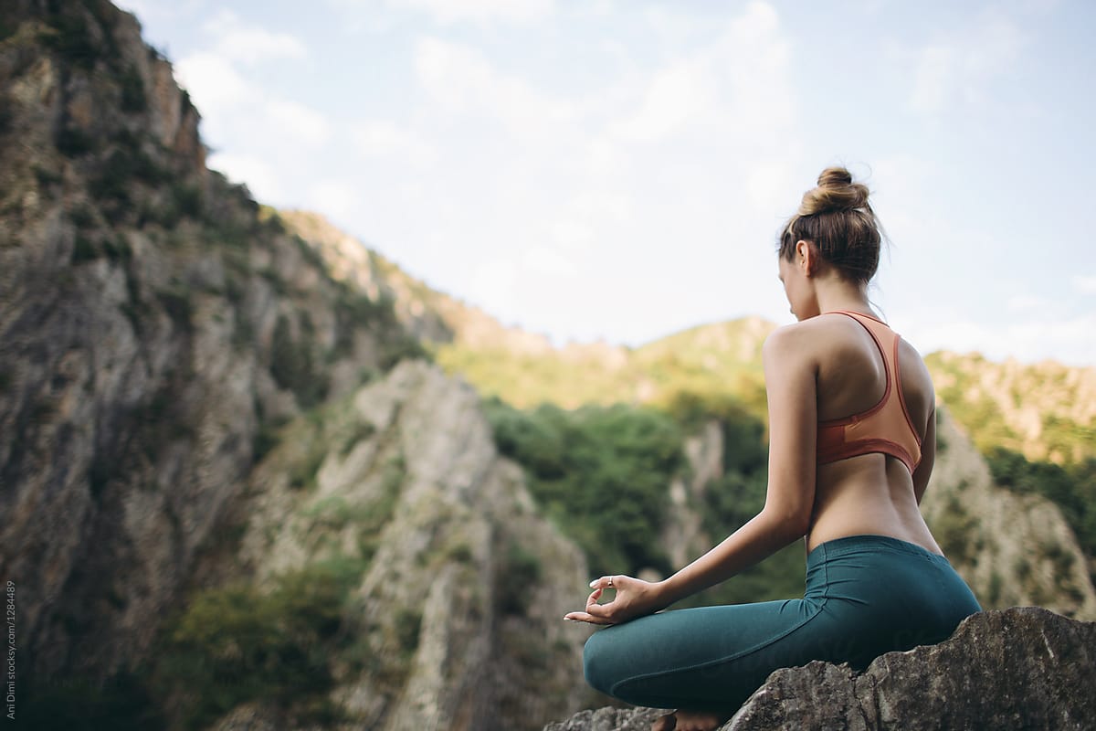 Woman Doing Yoga Meditation Outdoors By Stocksy Contributor Ani Dimi