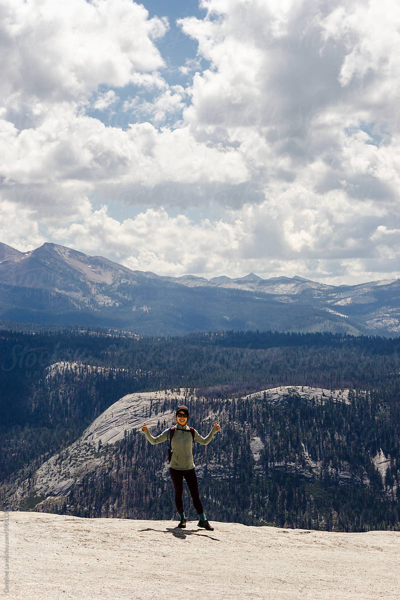 Hiker on top of Half Dome, Yosemite National Park
