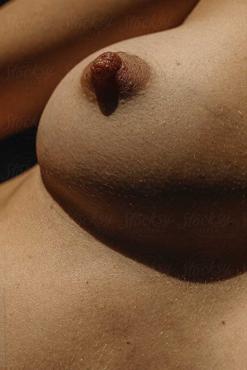 Close up photo of the skin texture of  female breast and nipple