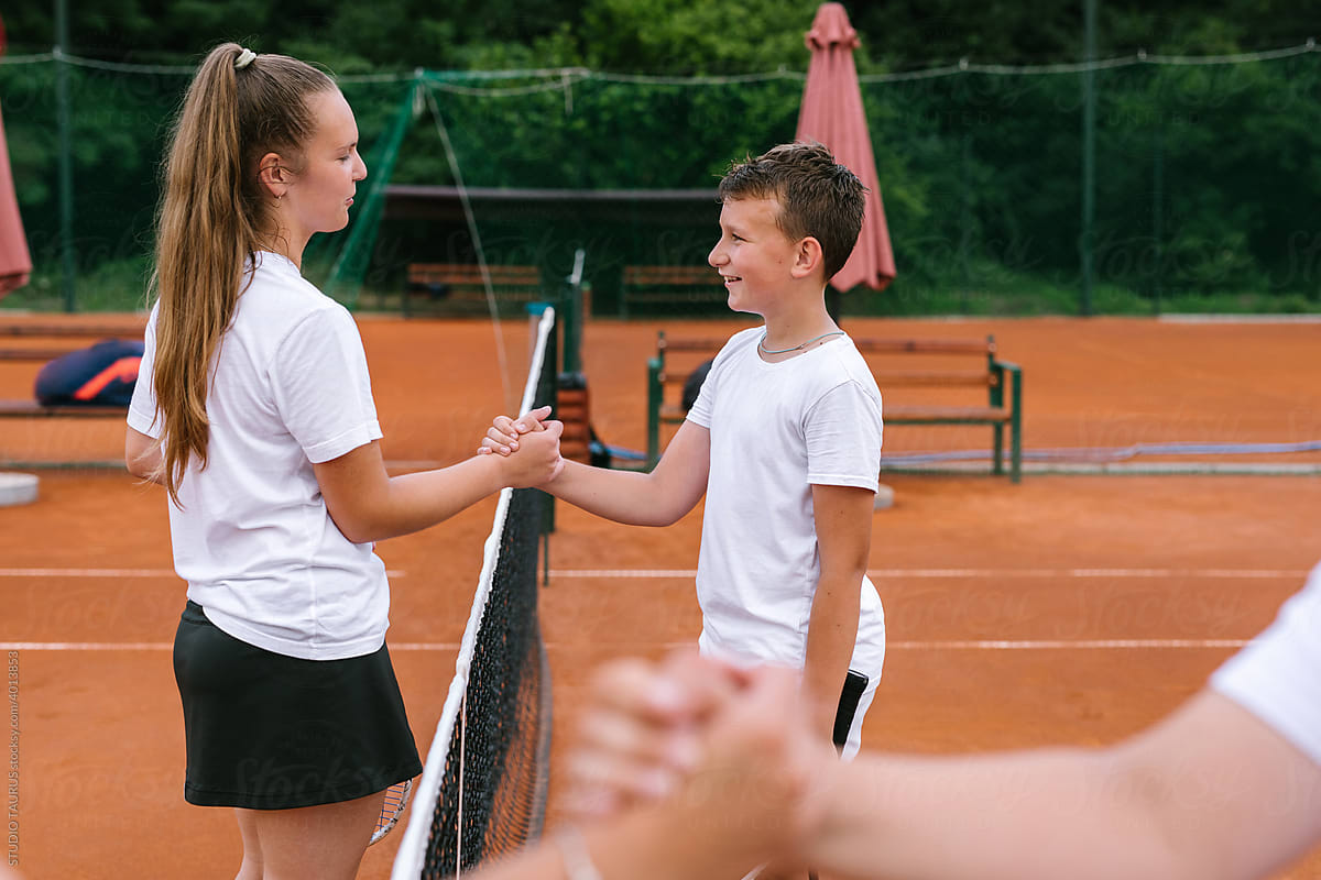 Children Greeting Each Other Before A Tennis Match