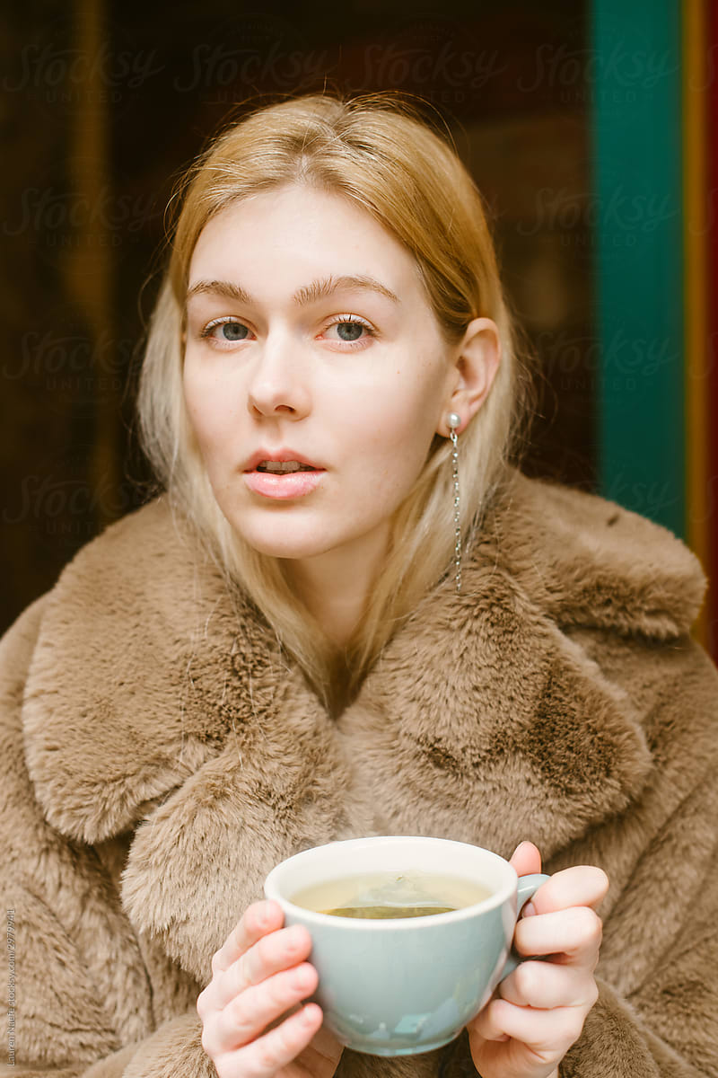 Young woman with green tea