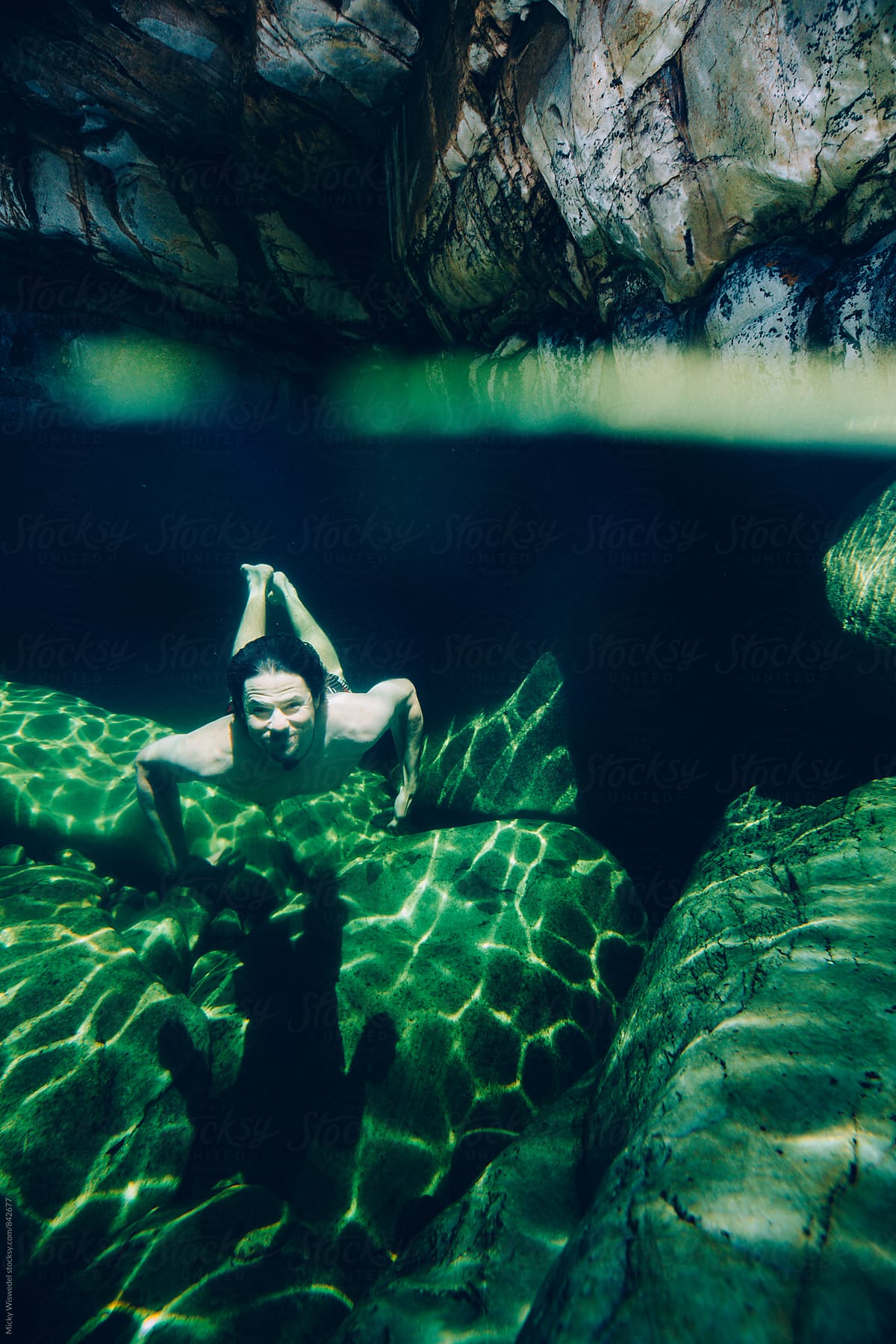 swimming underwater in a rockpool