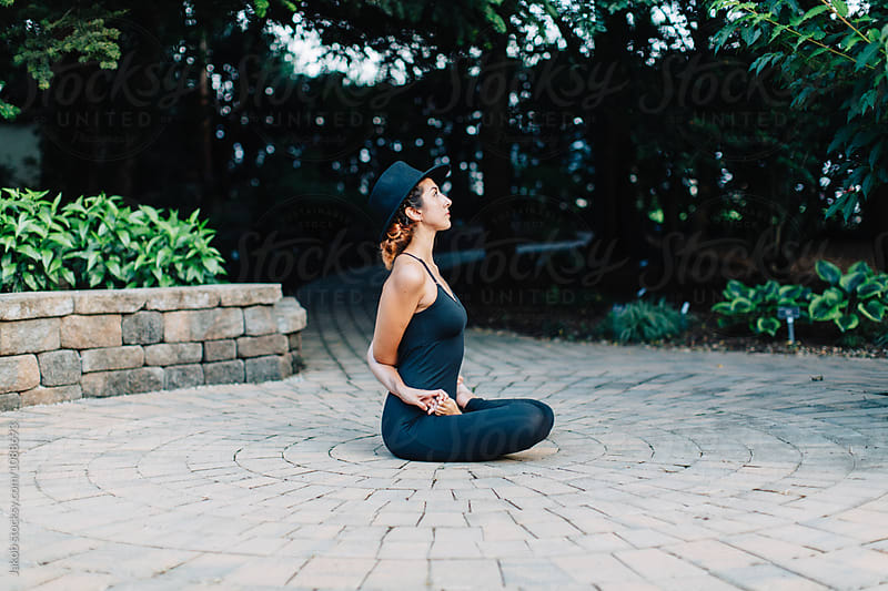 Healthy young woman meditating in full lotus position