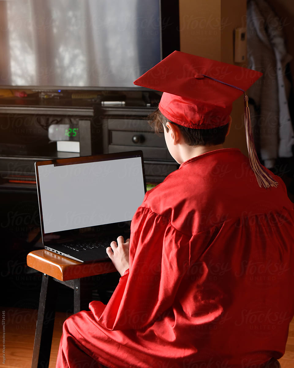 Boy Looking at Computer Screen Graduating