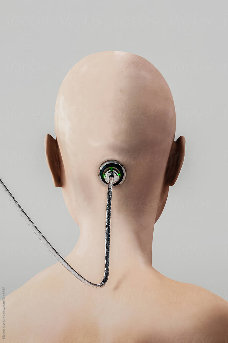 Rear view of a shaved head with a wire attached on head