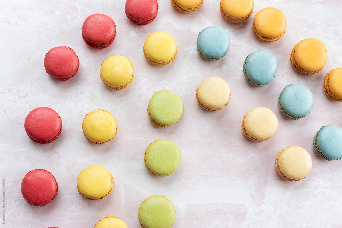Colorful macaroons on pink marble