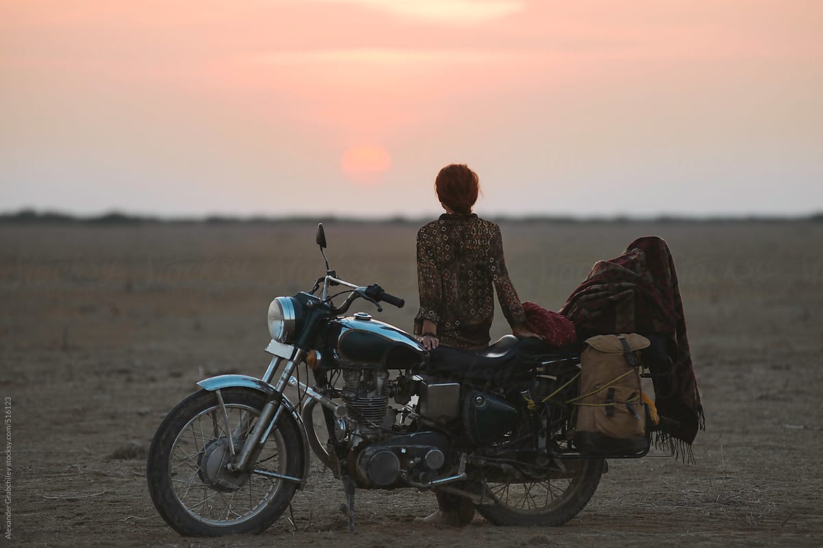 Woman Travels Alone on a Motorcycle in the Desert