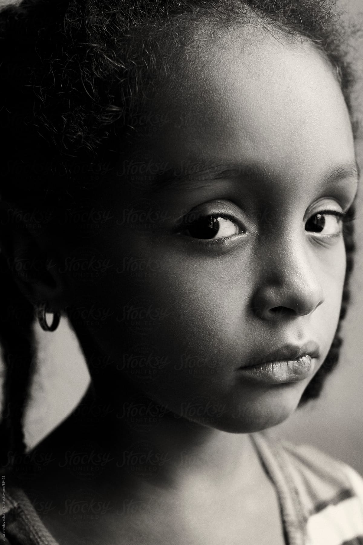 Portrait of young girl with a serious look on her face