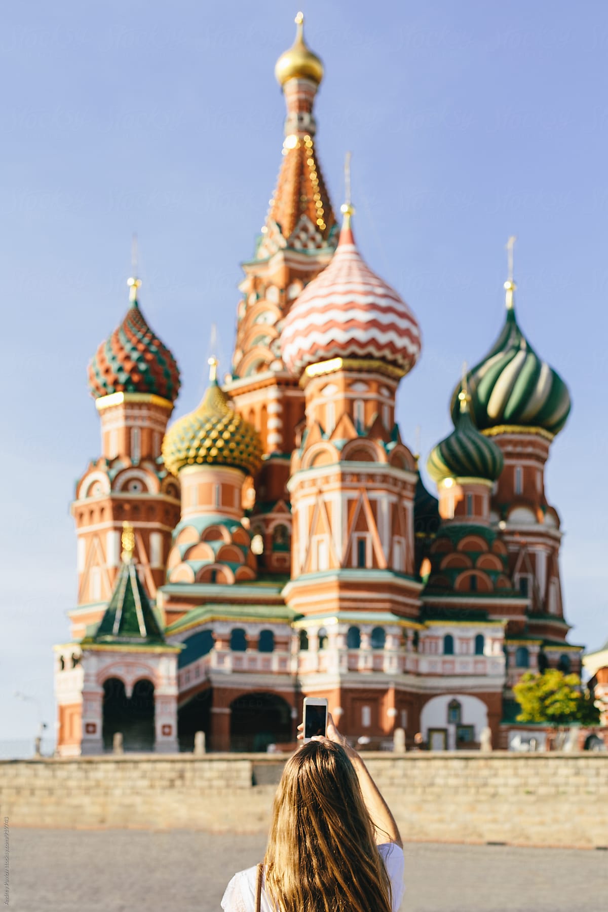 Back view of woman taking photo of Saint Basil\'s Cathedral
