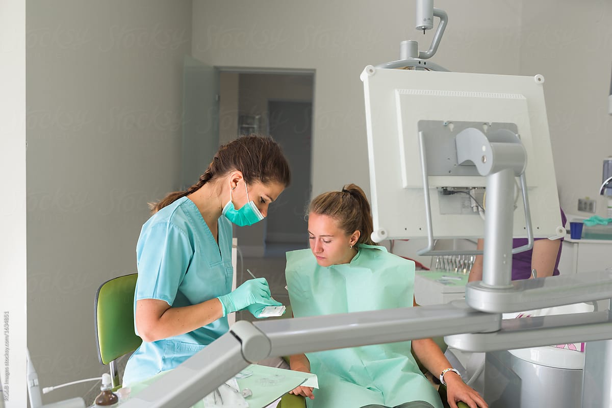 Orthodontist and patient in professional dental office