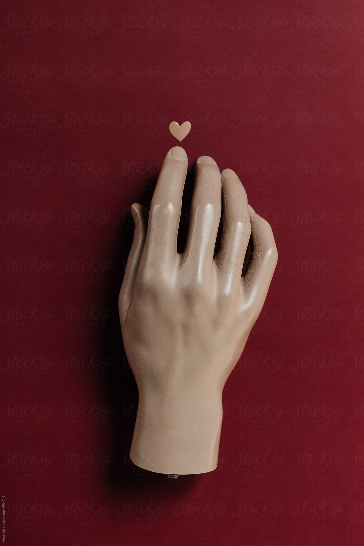 Manikin hand and small golden heart