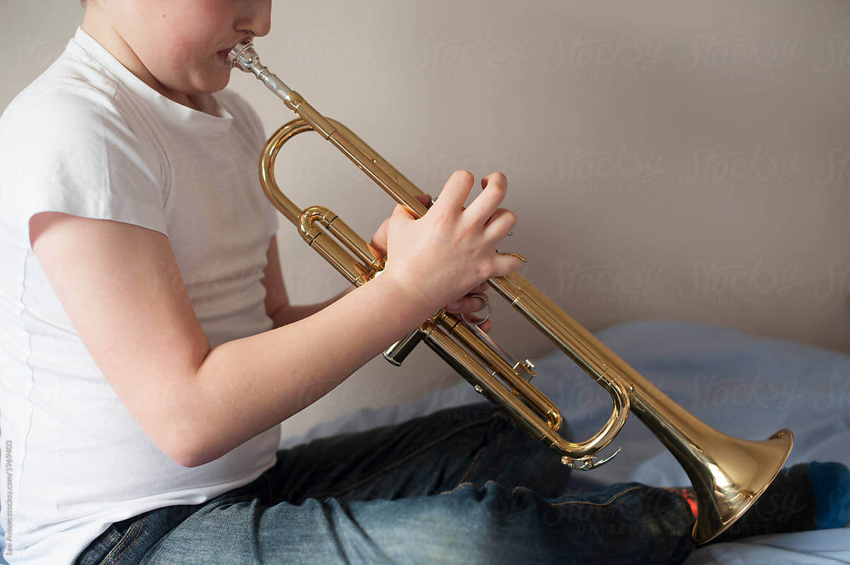 boy with trumpet musical instrument
