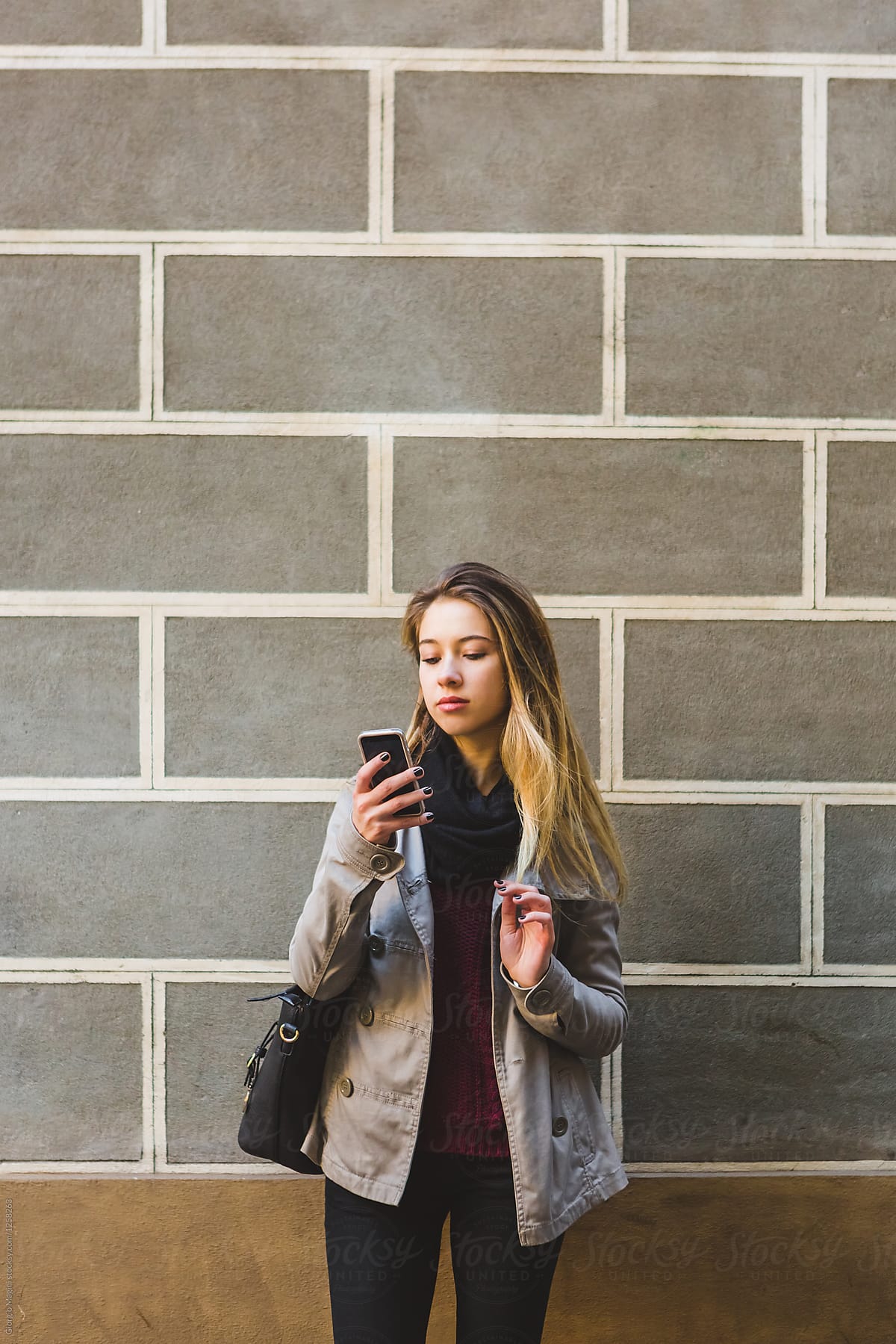 Teenage Girl in Urban Area Using a Mobile Phone