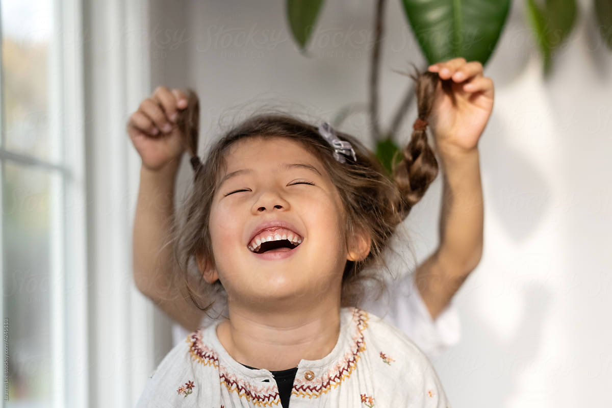 Child laughing and being playful