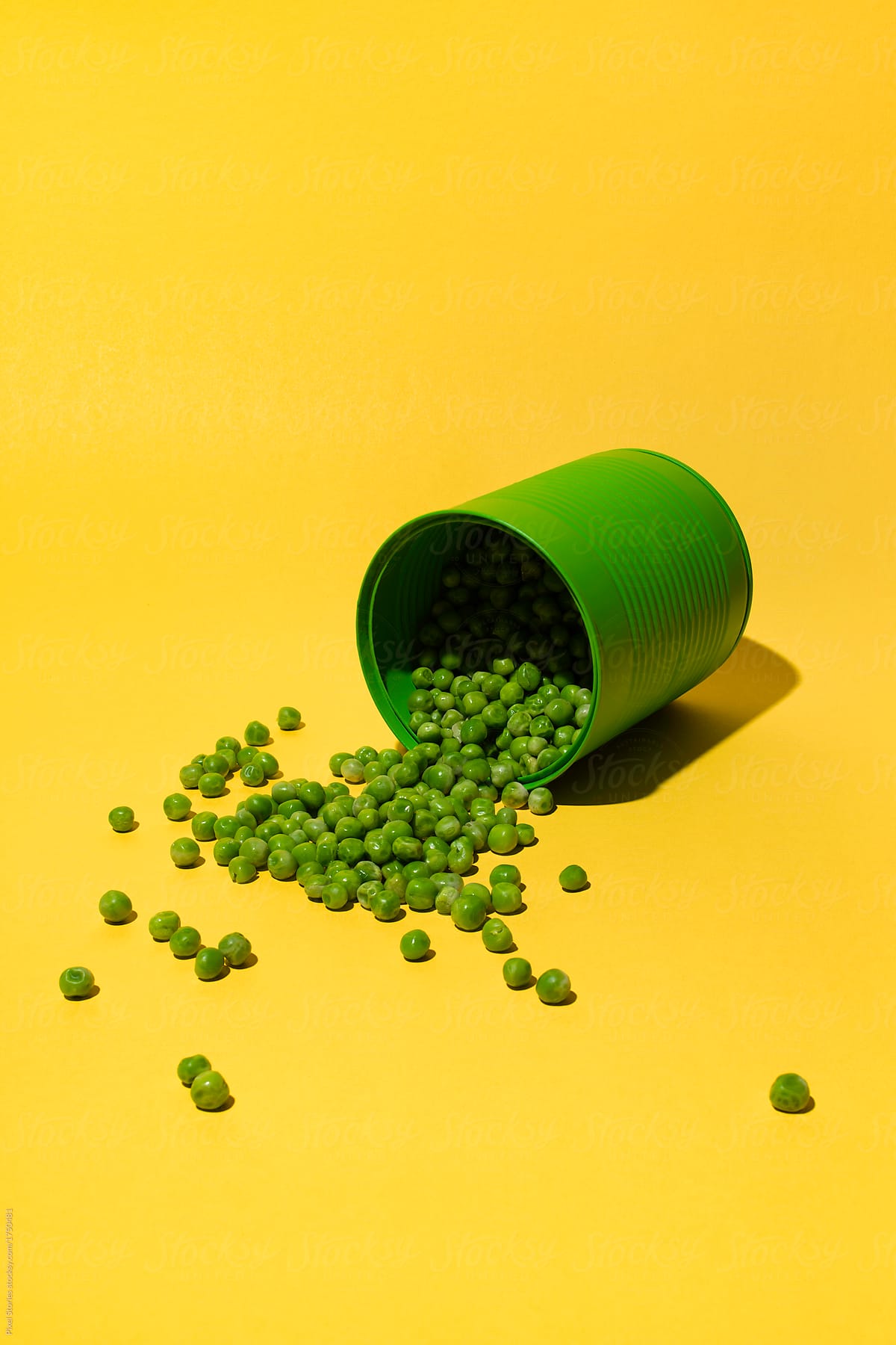 Canned peas on yellow background