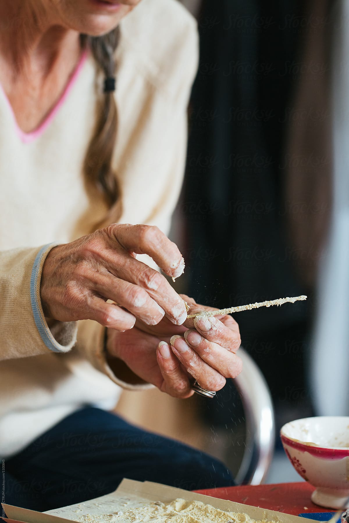 Close Up of Senior Woman Making Natural Incense Stick at Home