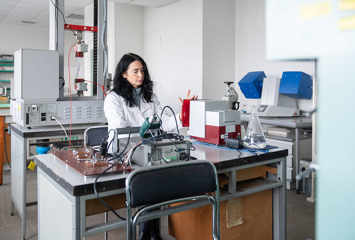Scientist Using Equipment Testing Quality Of Textile