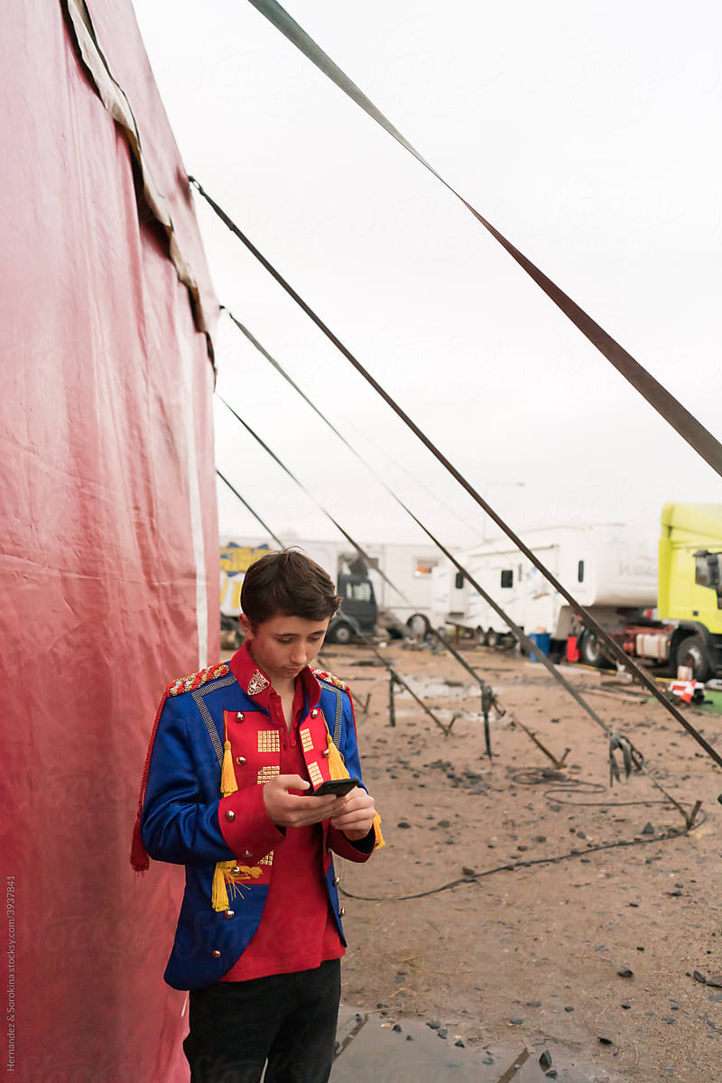 Young Circus Using Phone