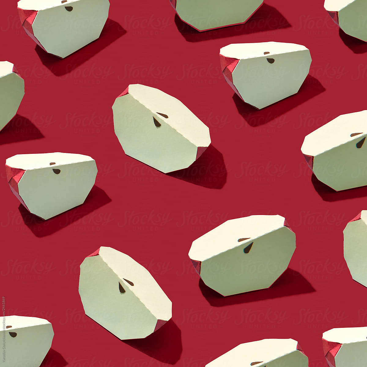 Slices of apples made of paper on a red background . Handcraft composition for layout. Flat lay