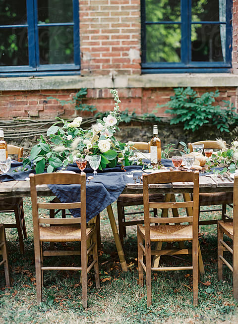 Orange Floral Arrangement On Table by Stocksy Contributor Vicki Grafton  Photography - Stocksy