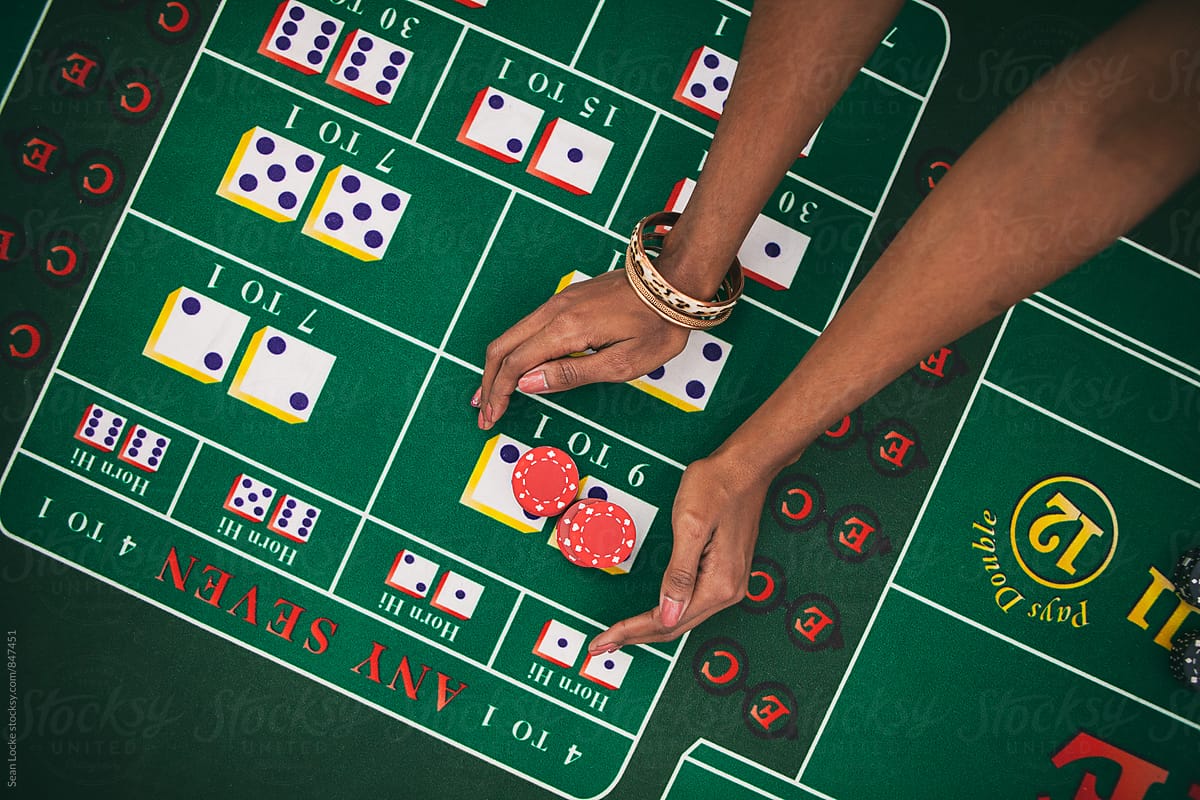 Casino: Woman Reaches Out To Grab Winnings From Craps Table