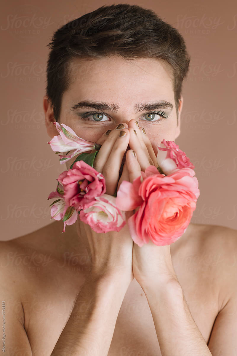 Portrait Of A Non-binary Man With Flowers