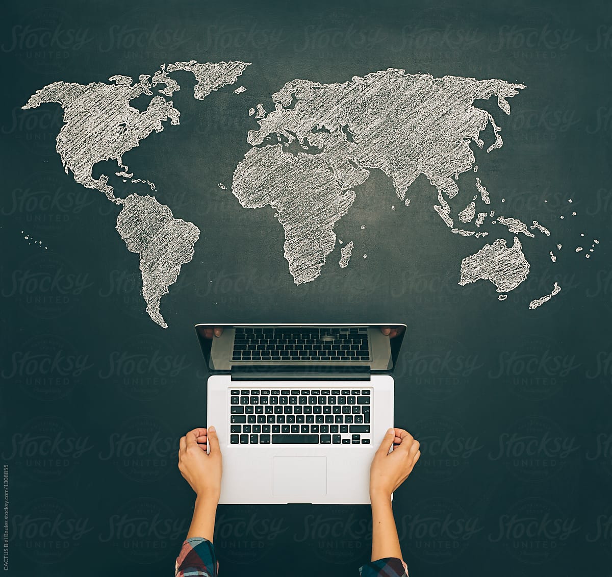 Blackboard with laptop and world map