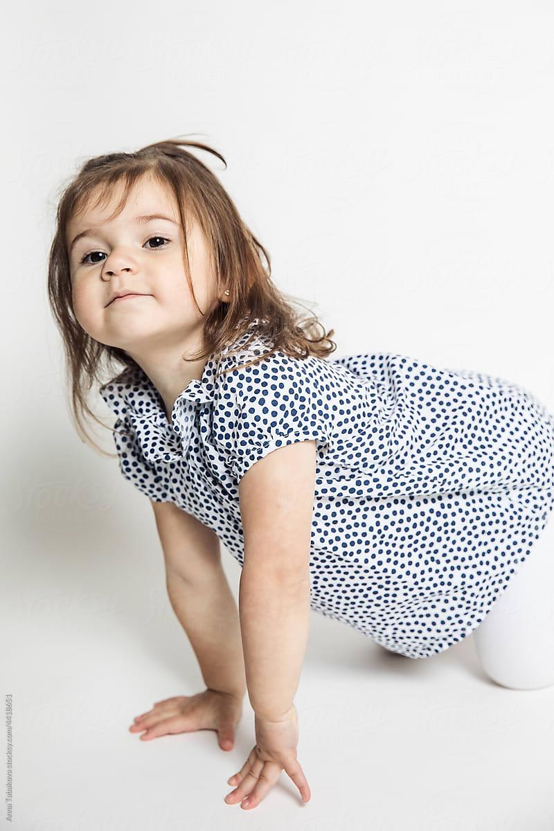 Little toddler girl modeling in studio