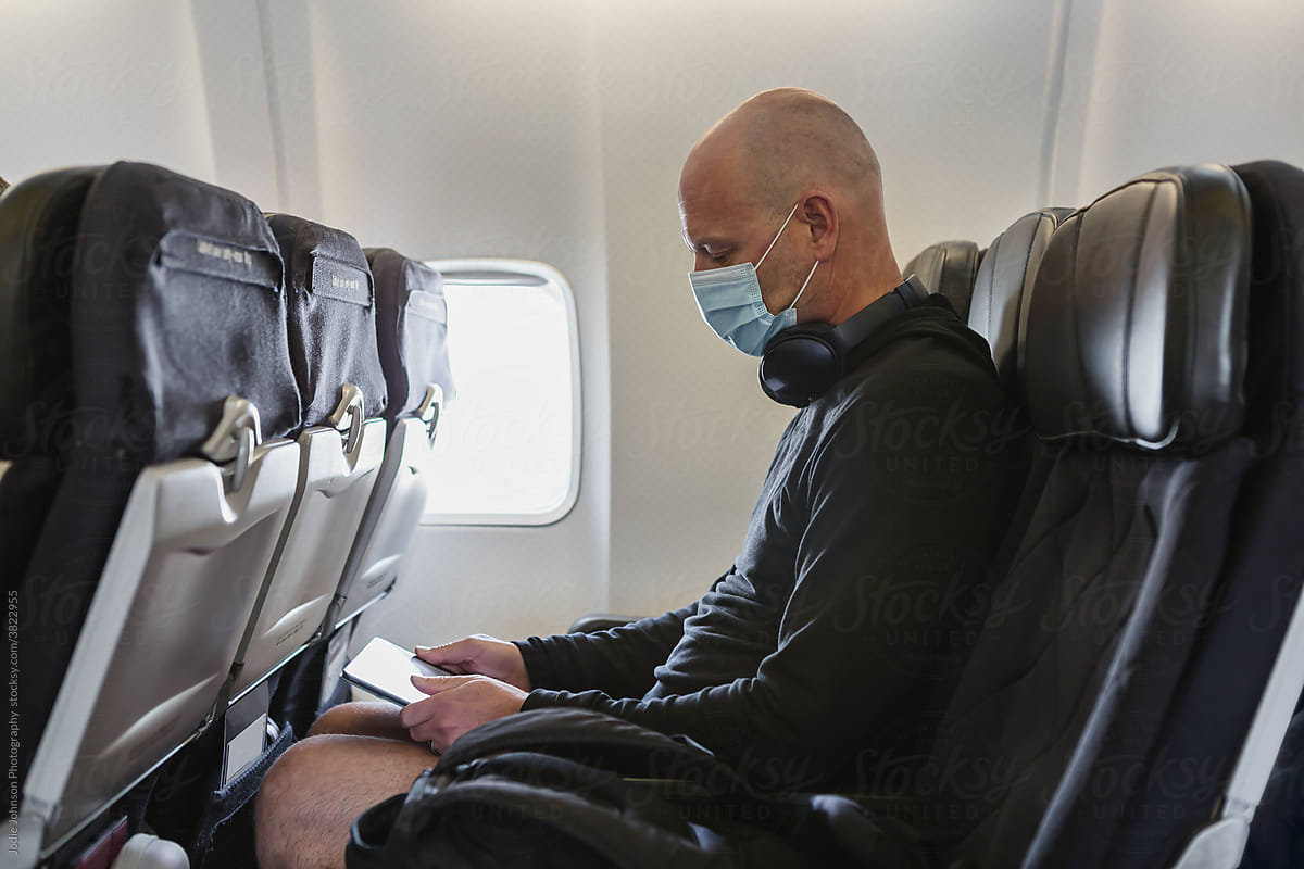 Masked man on a plane
