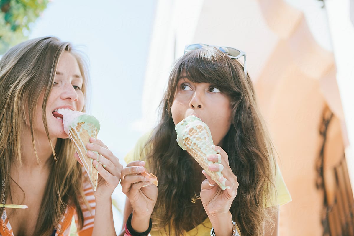 Two Young Women Students Eating Ice Cream on Spring Break in South Beach Miami