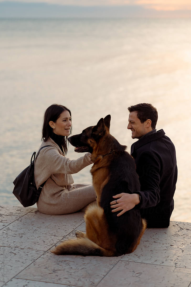 Couple with their dog at the seaside