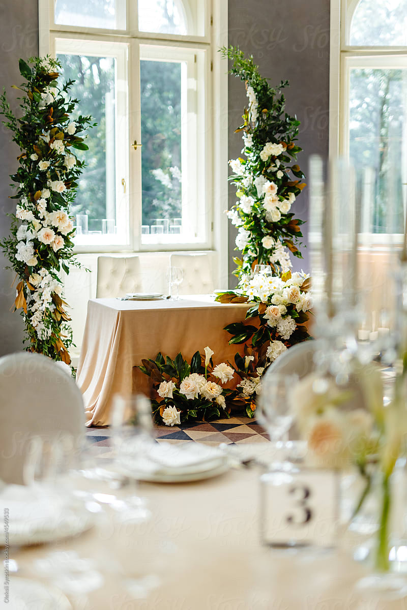 Reception table. Flower column. Festive table. Wedding banquet. Event