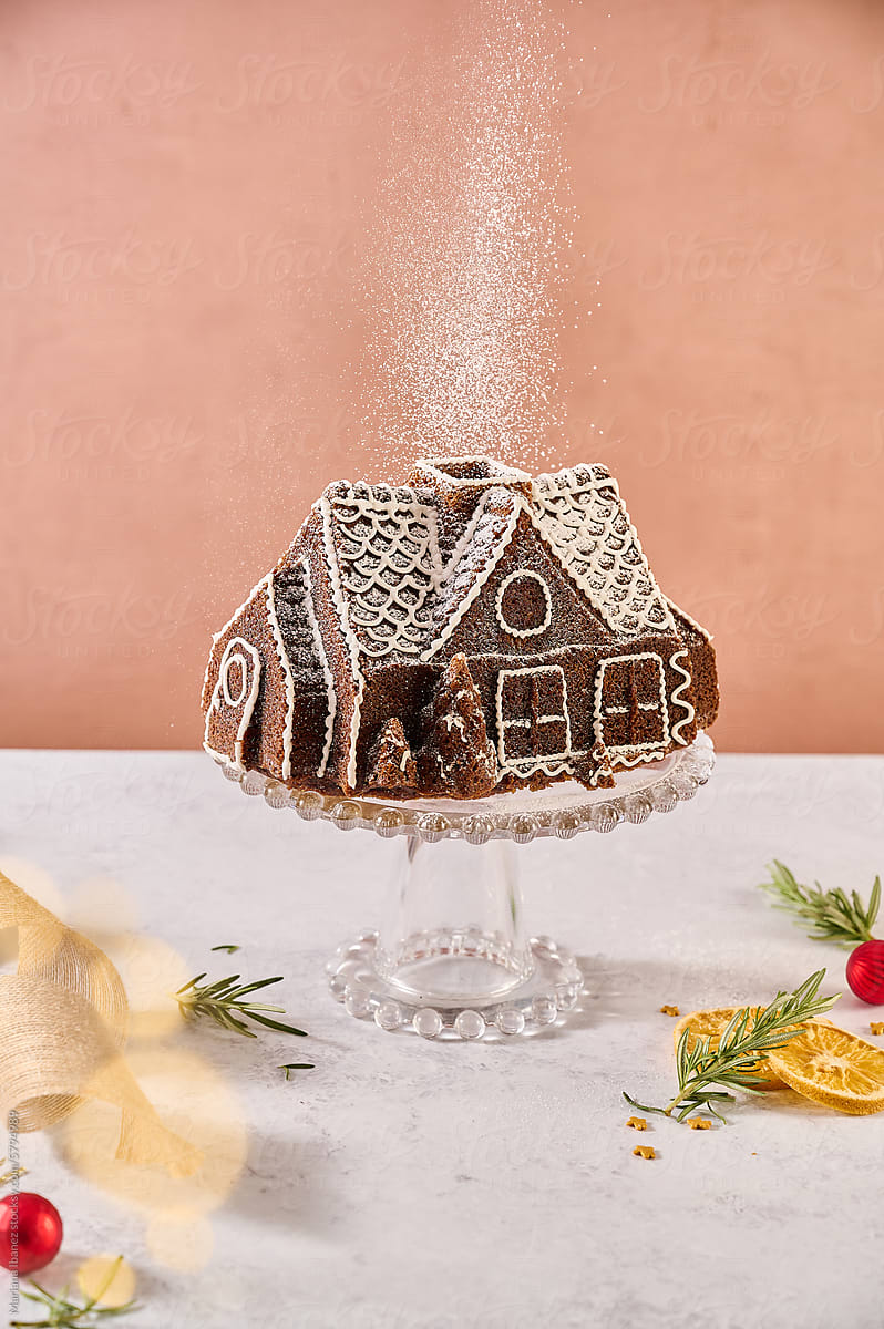 holiday gingerbread house with powdered sugar