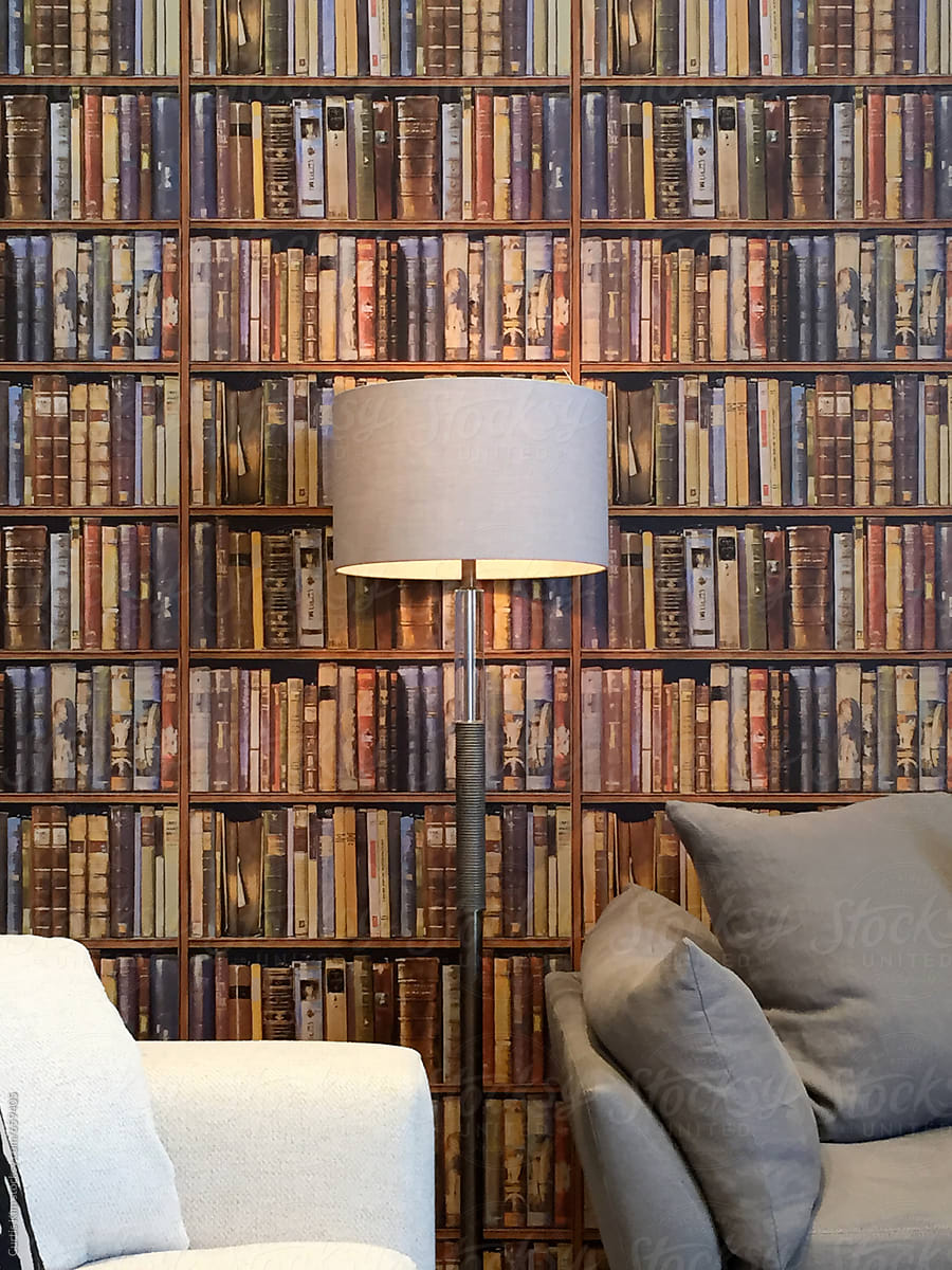 Wooden bookshelf with wall of books