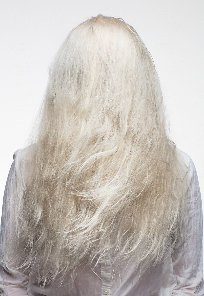A Blonde Woman With Hair All Over Her Face By Tim Booth Stocksy