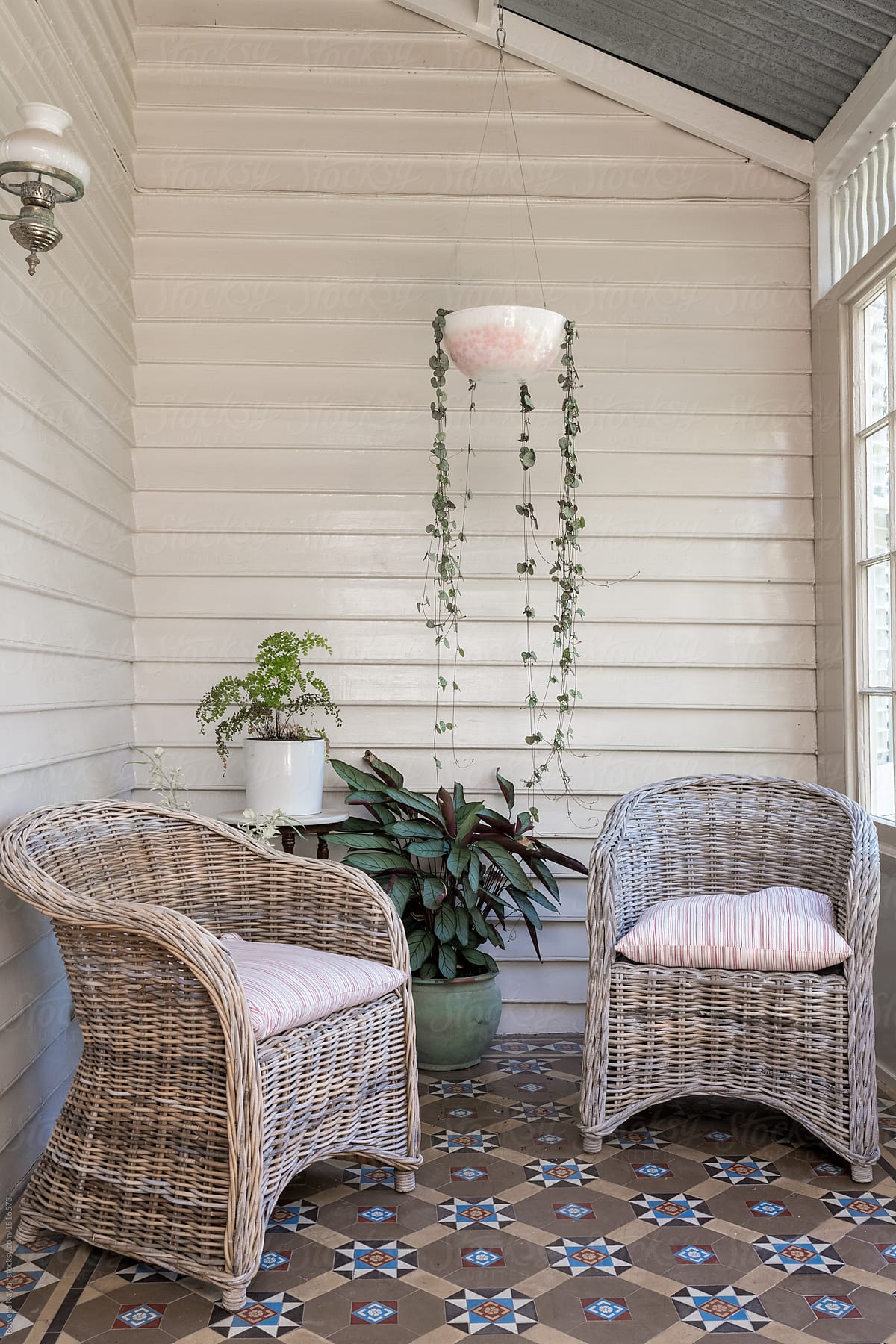 Cane chairs in summer conservatory of heritage home