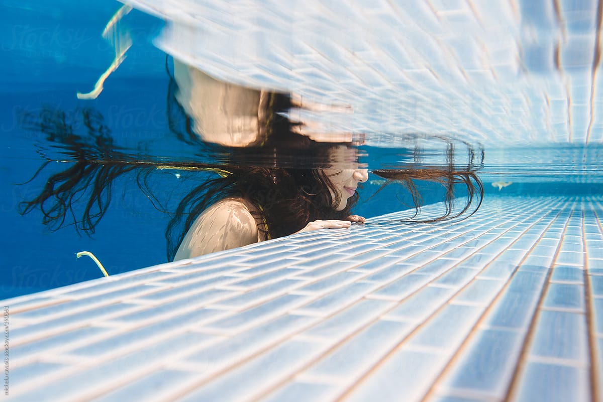 Woman Resting On The Edge Of Swimming Pool Underwater View Del