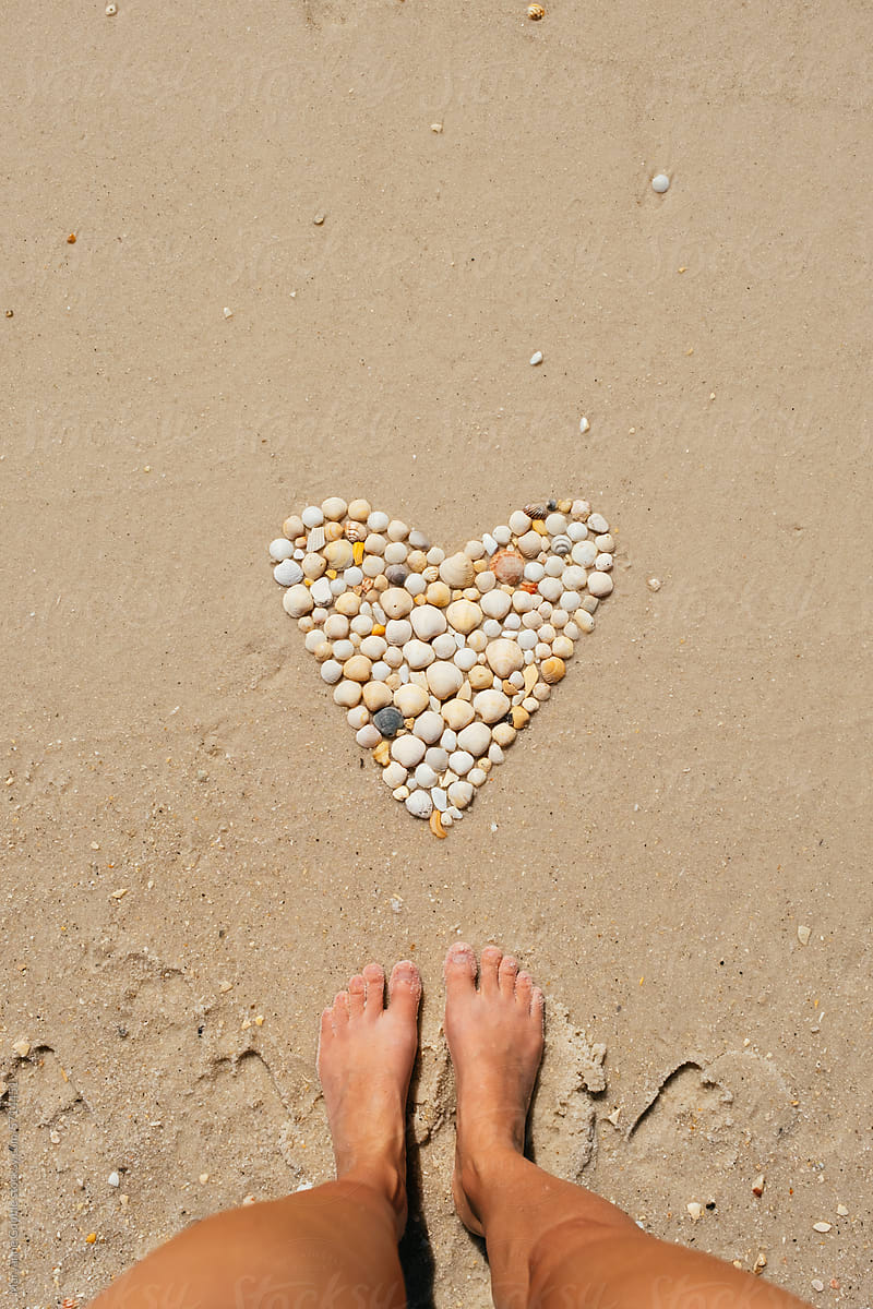 POV Seashell Heart Shape on Beach