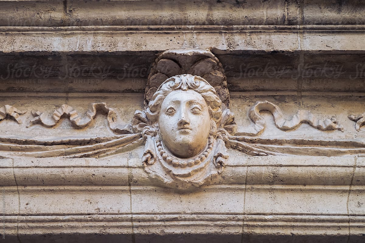 Detail of a head sculpture on a building