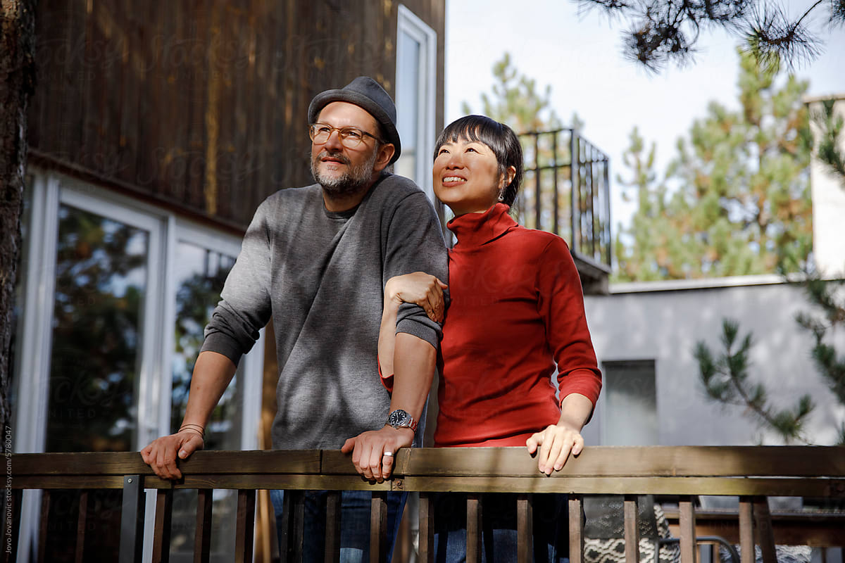 Relaxed couple experiencing peaceful time in log cabin