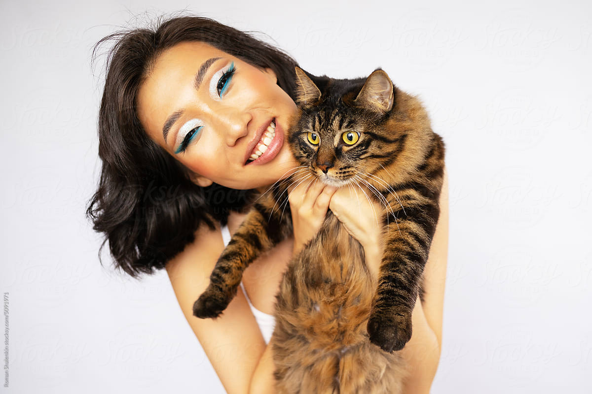Portrait of Beautiful Young Asian Woman with Bobtail Cat