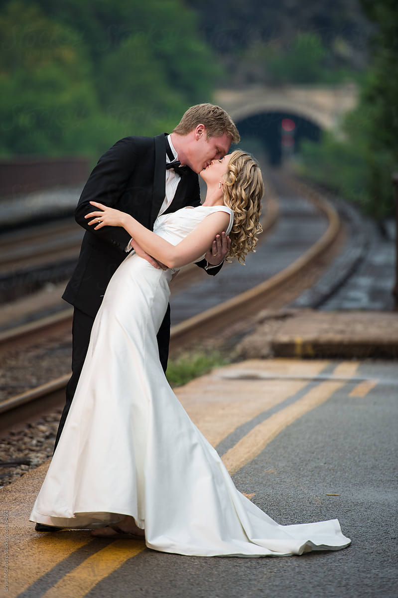 Just Married Couple Kiss on Railroad Platform