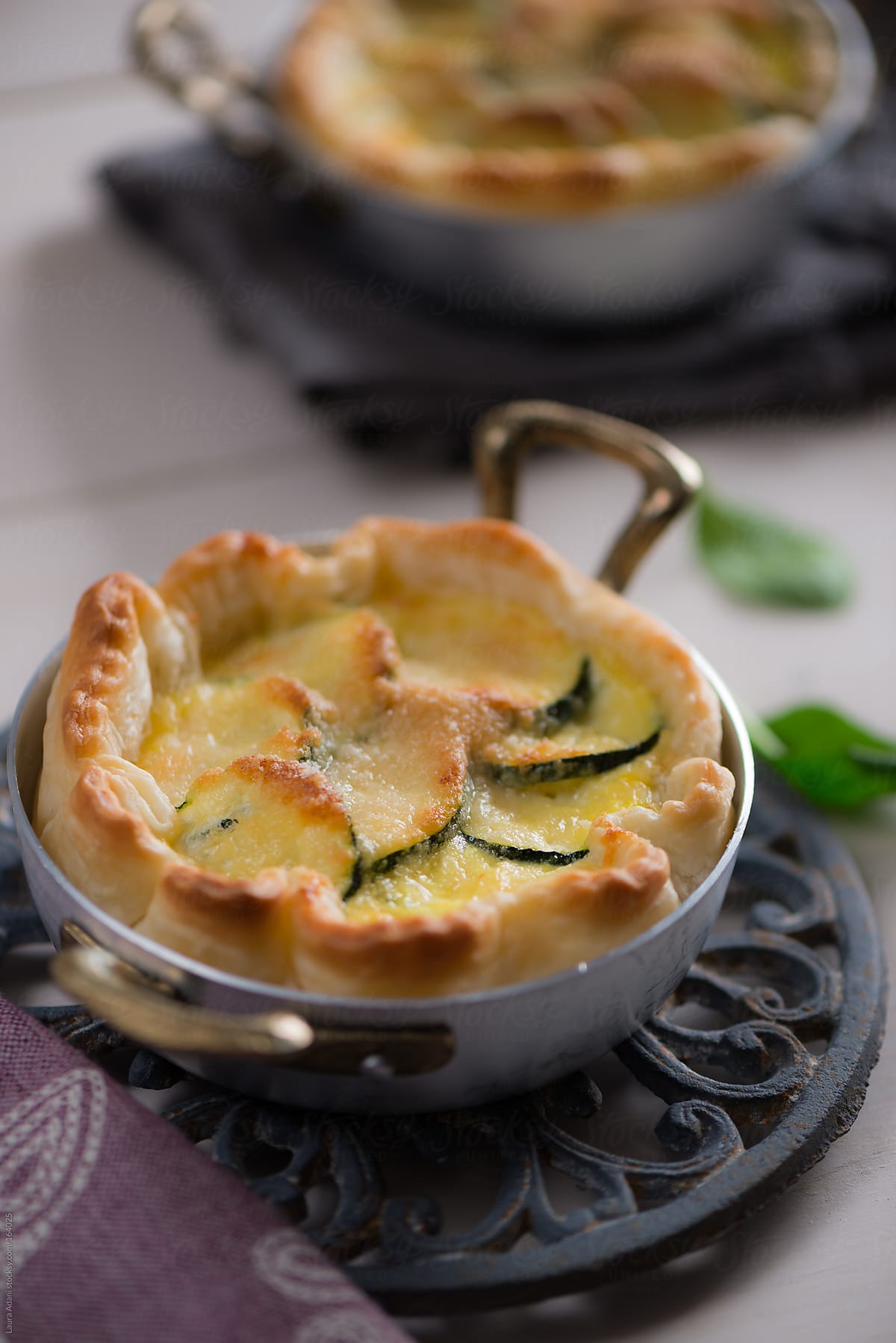 a courgette pie with eggs and cheese in a crust of pastry